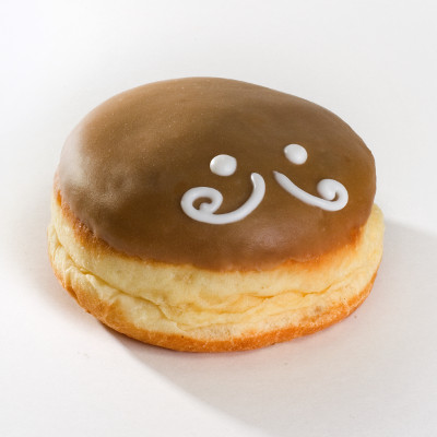 Round Bavarian cream-filled doughnut with maple frosting, two white frosting eyes, and a mustache