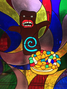 Stained Glass window of voodoo doll doughnut