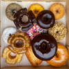 A top down shot of a Voodoo Classic Dozen Doughnuts.
