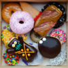 Top down image of a box of Voodoo Dozen Doughnuts