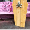 Coffin of Doughnuts upright outside with Three Pink Boxes