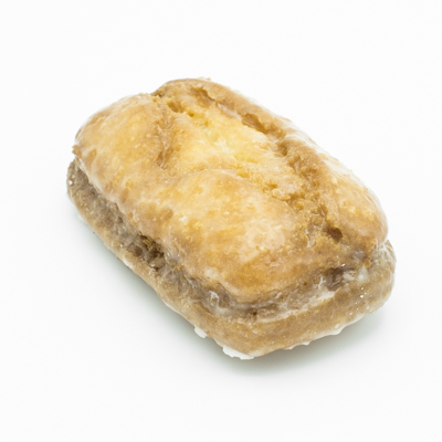 Bar shaped buttermilk style doughnut, with a shiny whitish glaze.