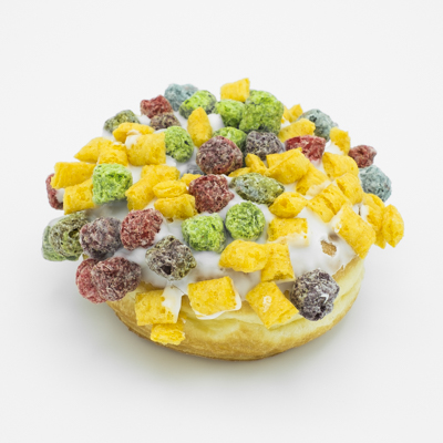 A raised yeast doughnut with vanilla frosting and Captain Crunch on top.