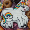 Horse-shaped and iced doughnut with rainbows and other doughnuts