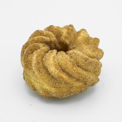 Image of a French cruller style doughnut sprinkled all over with cinnamon sugar.