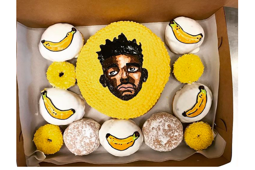 Custom Portrait Doughnut with Banana and other doughnuts in a box.