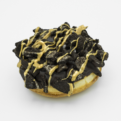 A yeast raised doughnut with chocolate frosting, Oreo cookie crumbles, and peanut butter drizzle.