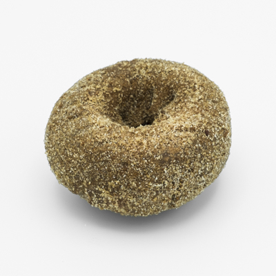 Image of a chocolate cake doughnut dusted all over with cinnamon sugar and cayenne pepper.
