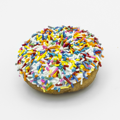 Cake doughnut with vanilla frosting and covered in multi-colored sprinkles.
