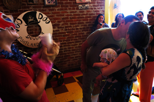 Couple kissing after Vow Renewal Re-do Your I Do ceremony at Voodoo Doughnut