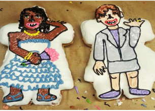 Wedding Doughnuts Bride and Groom Two doughnuts shaped and frosted to resmble a bride in a dress and in a suit