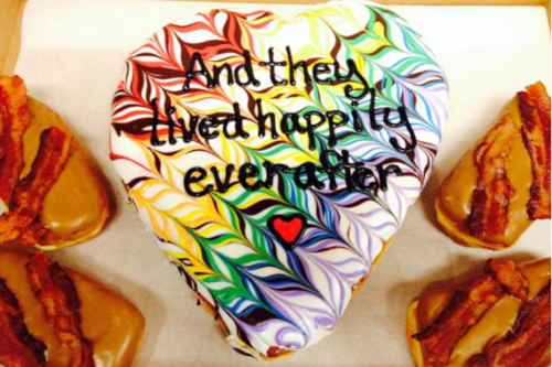 Heart Shaped Doughnut with multi-colored icing and the words "And they lived happily ever after"