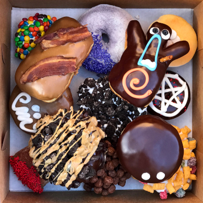Fryer Flyer Dozen Doughnuts box from above showing selection of doughnuts