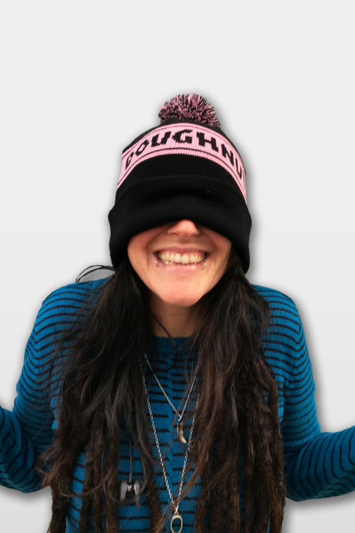 Woman wearing Voodoo Doughnut Beanie over her eyes.