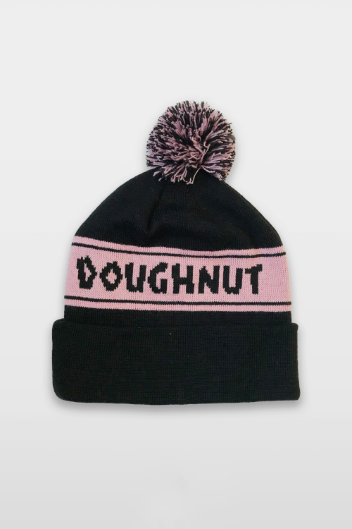 Back of Voodoo Doughnut black beanie showing a pink banded stripe with Doughnut in black letters.
