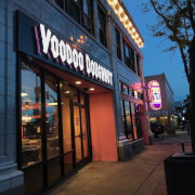 Storefront of Voodoo Doughnut shop on South Broadway in Denver, CO