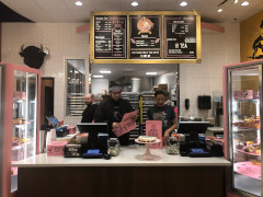 Buffalo Heights Press Release Staff preparing boxes behind the counter with a view of the menu board