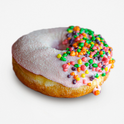 Raised yeast doughnut topped with strawberry frosting, lemonade dust and Nerd candies