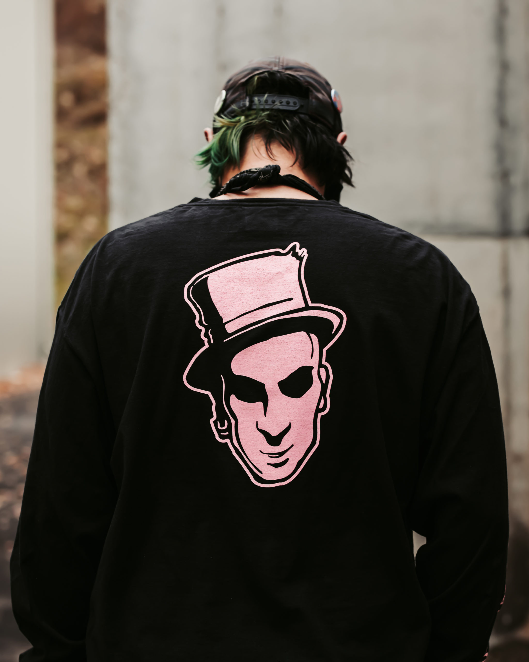 Black long sleeve shirt with large pink Baron head centered on back