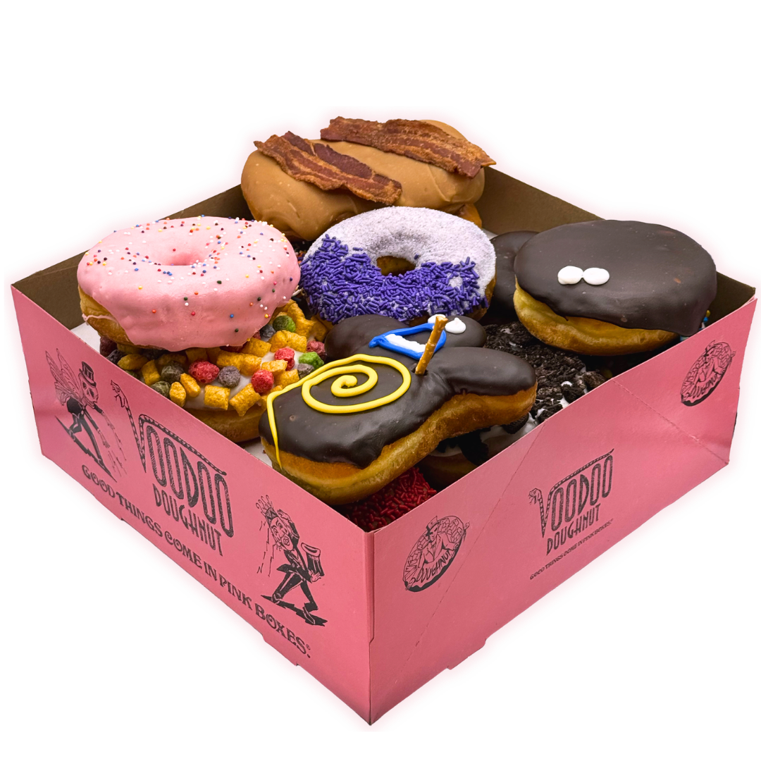 voodoo doughnut pink box filled with 13 doughnuts for the voodoo dozen